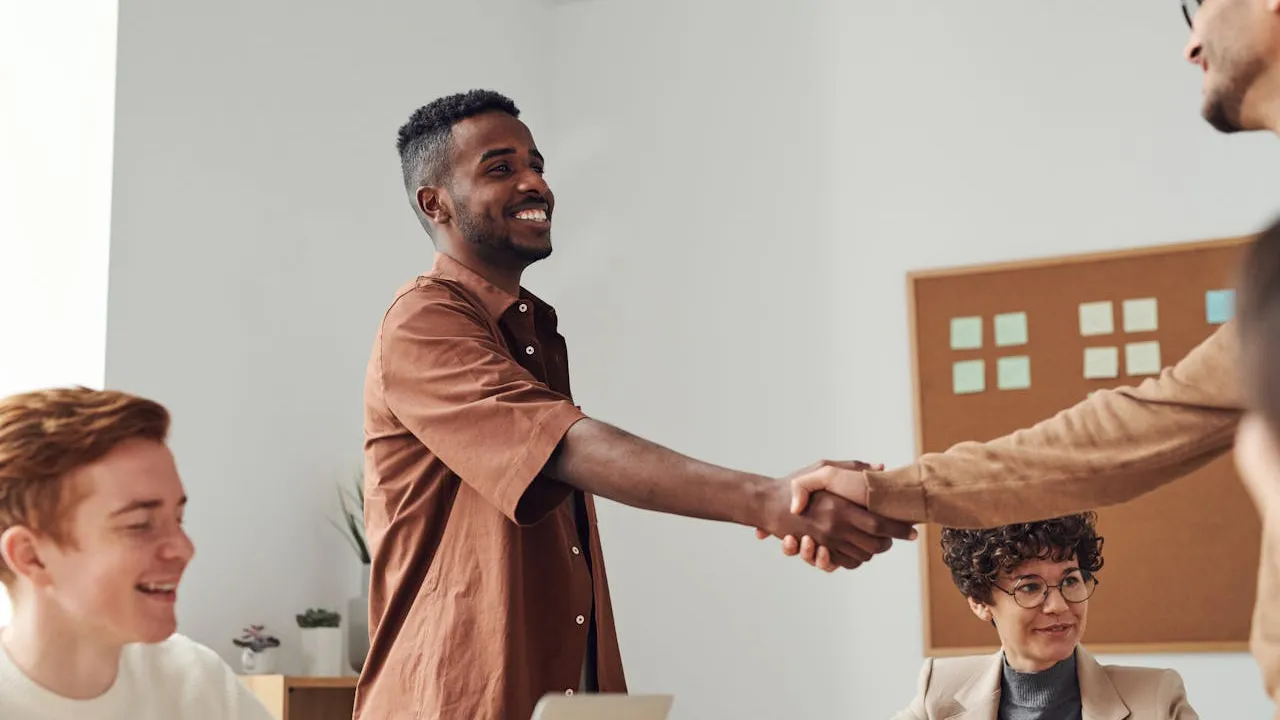 Web design clients shaking hands